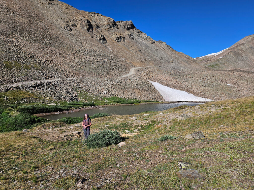 Woman by small lake along Mosquito Pass, Colorado